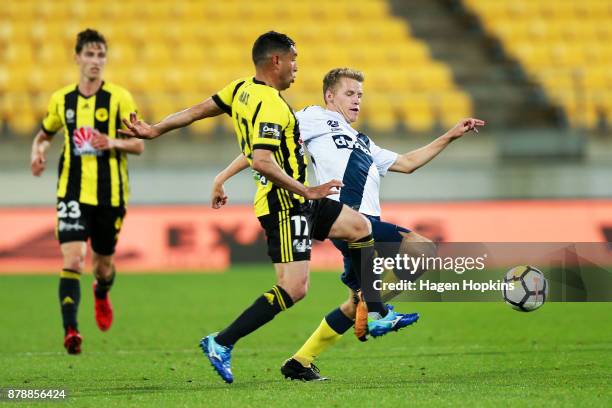 Trent Buhagiar of the Mariners and Ali Abbas of the Phoenix compete for the ball during the round eight A-League match between the Wellington Phoenix...