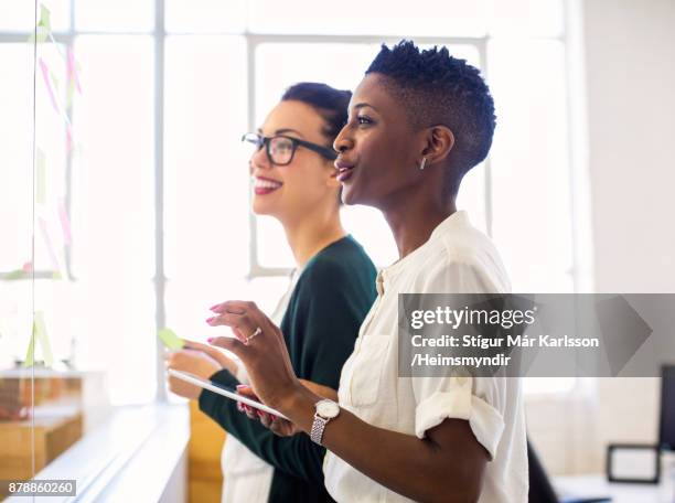 design professionals discussing in creative office - policy maker stock pictures, royalty-free photos & images