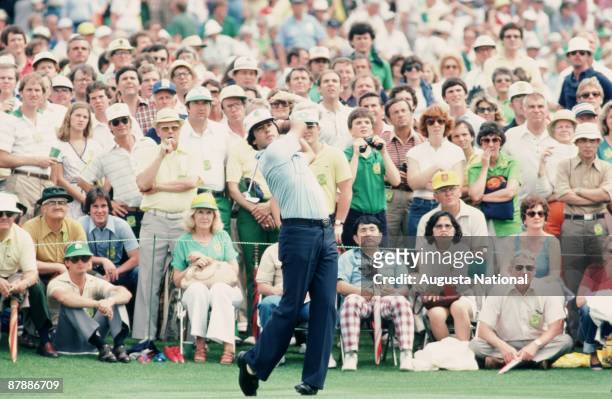 Masters Champion Seve Ballesteros watches tee shot in front of a large gallery during the 1980 Masters Tournament at Augusta National Golf Club in...