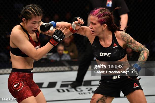 Gina Mazany punches Wu Yanan of China in their women's bantamweight bout during the UFC Fight Night event inside the Mercedes-Benz Arena on November...