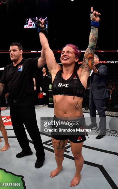 Gina Mazany celebrates after her decision victory over Wu Yanan of China in their women's bantamweight bout during the UFC Fight Night event inside...