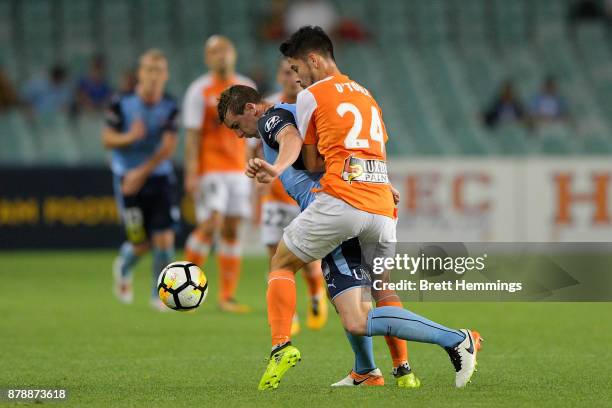 Sebastian Ryall of Sydney is tackled by Connor O'Toole of Brisbane during the round eight A-League match between Sydney FC and the Brisbane Roar at...