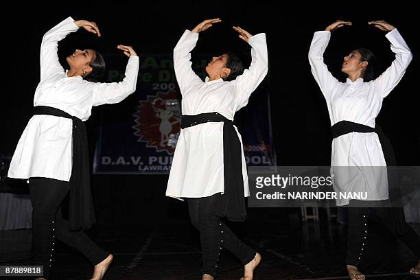 Indian school girls perform a classical dance during the annual prize distribution function at DAV Public school in Amritsar on May 21, 2009. India...
