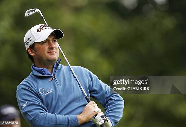 Northern Irish golfer Graeme McDowell watches his drive from the 2nd tee during the first day of the PGA Championship on the West Course at...