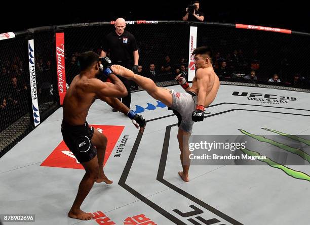 Song Yadong of China kicks Bharat Kandare of India in their featherweight bout during the UFC Fight Night event inside the Mercedes-Benz Arena on...