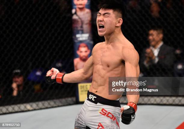 Song Yadong of China celebrates after his victory over Bharat Kandare in their featherweight bout during the UFC Fight Night event inside the...