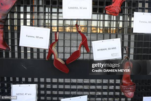 Picture taken on November 25, 2017 near the courthouse of Nantes shows red-painted shoes symbolizing all the women victims of domestic violence,...