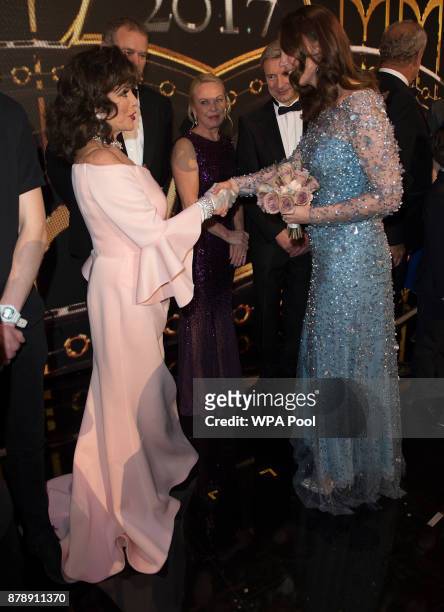 Catherine, Duchess of Cambridge speaks to Joan Collins on stage as they attend the Royal Variety Performance at the Palladium Theatre on November...