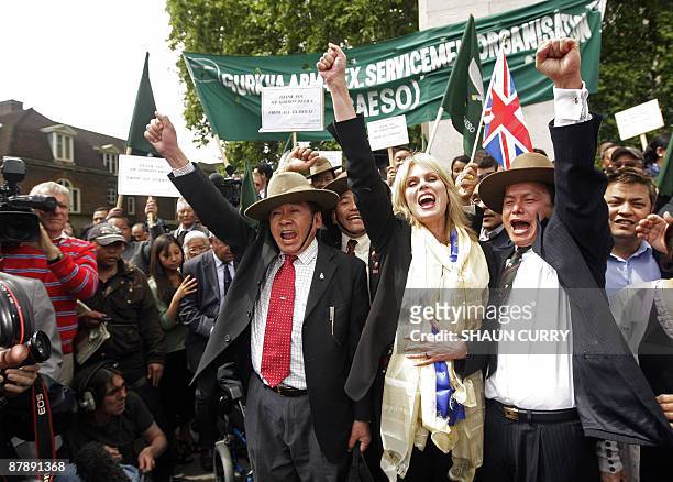 British actress and Gurkha campaigner Joanna Lumley celebrates with former Gurkha soldiers in central London on May 21, 2009. Britain announced...