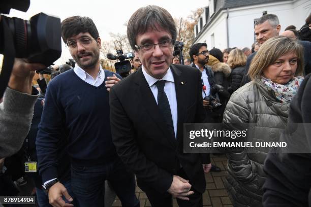 Deposed Catalan leader Carles Puigdemont leaves after posing with his fellow candidates after a press conference in Oostkamp, near Brugge, on...