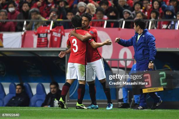 Tomoya Ugajin of Urawa Red Diamonds is replaced by Mauricio during the AFC Champions League Final second leg match between Urawa Red Diamonds and...