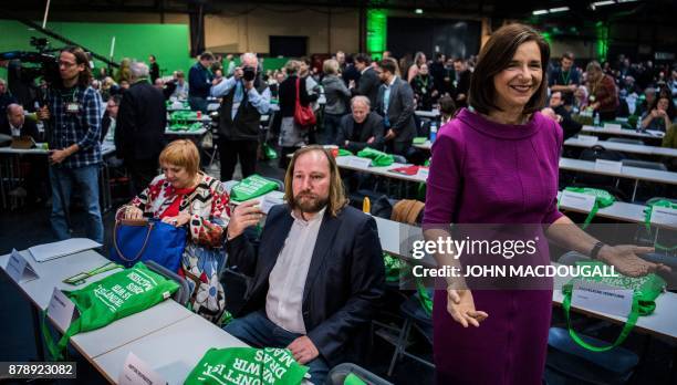 Parliamentary group co-leader of the Green party, Katrin Goering-Eckardt gestures towards photographers as parliamentary group co-leader of the Green...