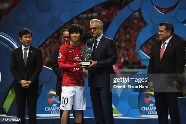 Yosuke Kashiwagi of Urawa Red Diamonds receives the most Valuable Player Award by the Asian Football Confederations President Shaikh Salman bin...