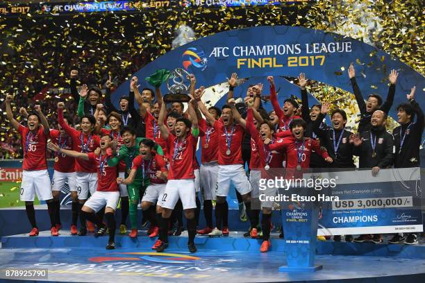Captain Yuki Abe of Urawa Red Diamonds lifts the AFC Champions League trophy at the award ceremony during the AFC Champions League Final second leg...