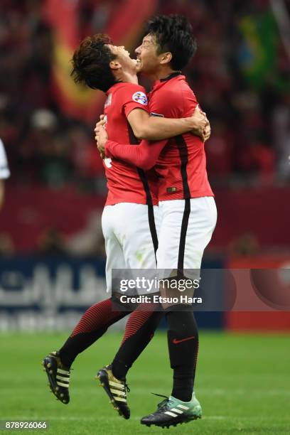 Kazuki Nagasawa and Takuya Aoki of Urawa Red Diamonds celebrate their 1-0 victory and the Asian Champions after the AFC Champions League Final second...