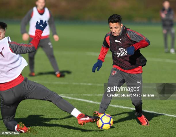 Shkodran Mustafi and Alexis Sanchez of Arsenal during a training session at London Colney on November 25, 2017 in St Albans, England.