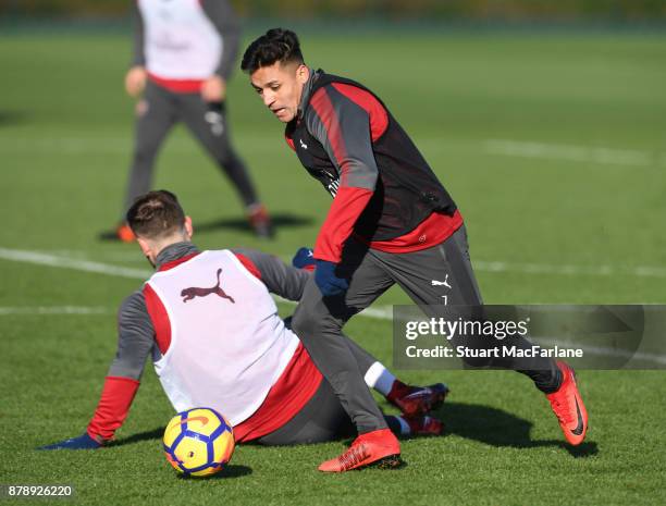 Shkodran Mustafi and Alexis Sanchez of Arsenal during a training session at London Colney on November 25, 2017 in St Albans, England.