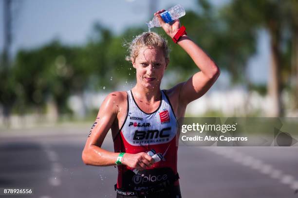 Emma Pallant of Great Britain refreshes during the run leg of IRONMAN 70.3 Middle East Championship Bahrain on November 25, 2017 in Bahrain, Bahrain.