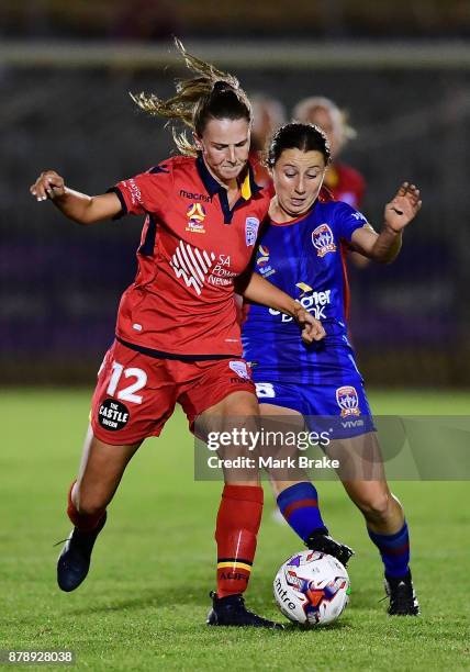 Chelsea Dawber of Adelaide United and Clare Huster of Newcastle Jets during the round five W-League match between Adelaide United and Newcastle Jets...