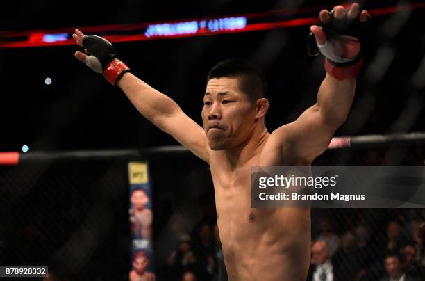 Li Jingliang of China celebrates after his knockout victory over Zak Ottow in their welterweight bout during the UFC Fight Night event inside the...