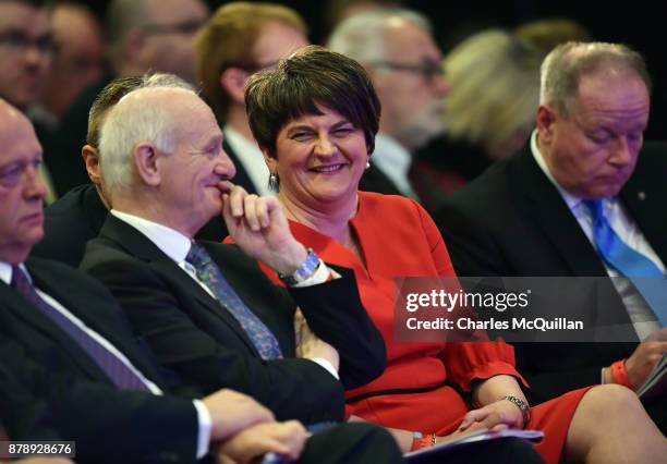 Democratic Unionist Party leader Arlene Foster jokes with party members before giving her leader's speech during the annual DUP party conference at...