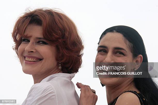 French director and actress Fanny Ardant and Israeli actress Ronit Elkabetz pose during the photocall of the movie "Cendres et Sang" presented out of...