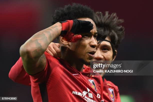 Urawa Red Diamonds' forward Rafael Da Silva celebrates scoring with midfielder Yosuke Kashiwagi during the second leg of the AFC Champions League...