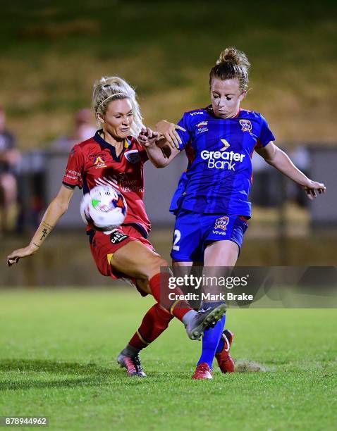 Adriana Jones of Adelaide United tackles Hannah Brewer of Newcastle Jets during the round five W-League match between Adelaide United and Newcastle...