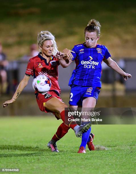 Adriana Jones of Adelaide United tackles Tara Andrews of Newcastle Jets during the round five W-League match between Adelaide United and Newcastle...