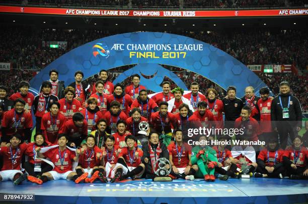 Urawa Red Diamonds players and staffs pose for photographs after the AFC Champions League Final second leg match between Urawa Red Diamonds and...