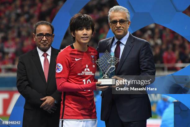 Yosuke Kashiwagi of Urawa Red Diamonds receives the most Valuable Player Award by the Asian Football Confederation President Shaikh Salman bin...