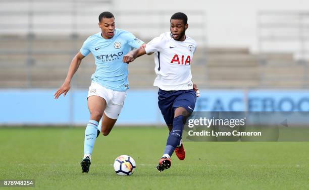 Japhet Tanganga of Tottenham Hotspur and Lucas Nmecha of Manchester City during the Premier League 2 match at The Academy Stadium on November 25,...