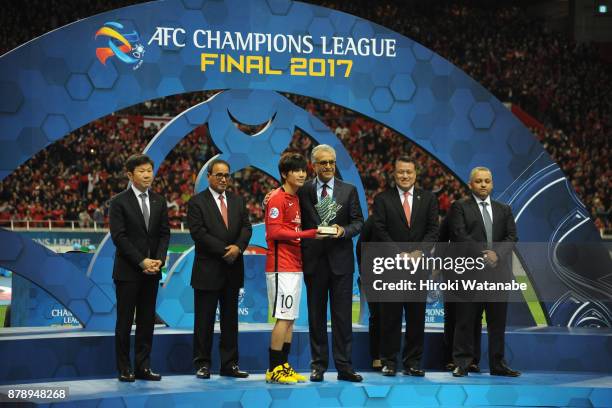 Yosuke Kashiwagi of Urawa Red Diamonds receives the most Valuable Player Award by the Asian Football Confederation President Shaikh Salman bin...