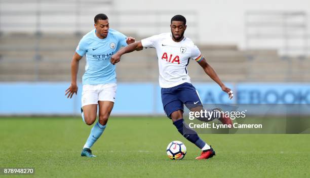 Japhet Tanganga of Tottenham Hotspur and Lucas Nmecha of Manchester City during the Premier League 2 match at The Academy Stadium on November 25,...