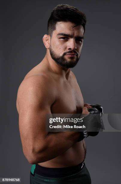 Kelvin Gastelum poses for a portrait backstage after his victory over Michael Bisping during the UFC Fight Night event inside the Mercedes-Benz Arena...