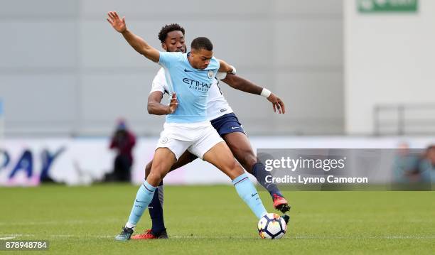 Christian Maghoma of Tottenham Hotspur and Lucas Nmecha of Manchester City during the Premier League 2 match at The Academy Stadium on November 25,...