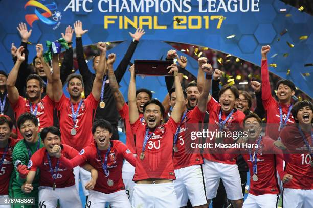 Shinzo Koroki of Urawa Red Diamonds lifts the AFC Champions League trophy at the award ceremony during the AFC Champions League Final second leg...