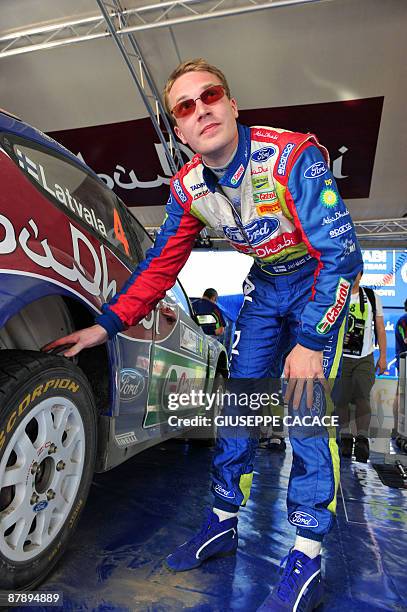 Finnish Jari Matti Latvala checks his car during the shakedown stage of the WRC Italian auto rally 2009 on May 21, 2009 in Olbia, Sardinia. The World...