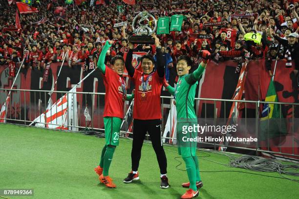 Tetsuya Enomoto, goalkeeper coach Hisashi Tsuchida and Shusaku Nishikawa of Urawa Red Diamonds celebrate after the AFC Champions League Final second...