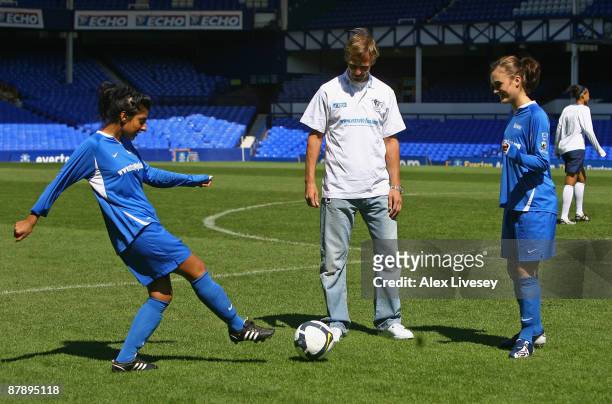 Teddy Sheringham warms up with Lena Kaur and Loui Batley from Hollyoaks at the first ever All Female Football Aid Charity Game with Wrigley's Extra...