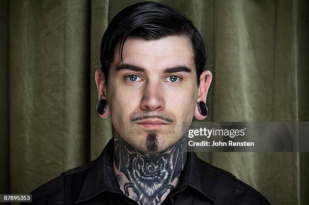 portrait of man with neck tattoo - pierced stock pictures, royalty-free photos & images