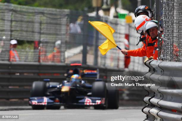 Yellow flag is waved by marshalls during practice for the Monaco Formula One Grand Prix at the Monte Carlo Circuit on May 21, 2009 in Monte Carlo,...