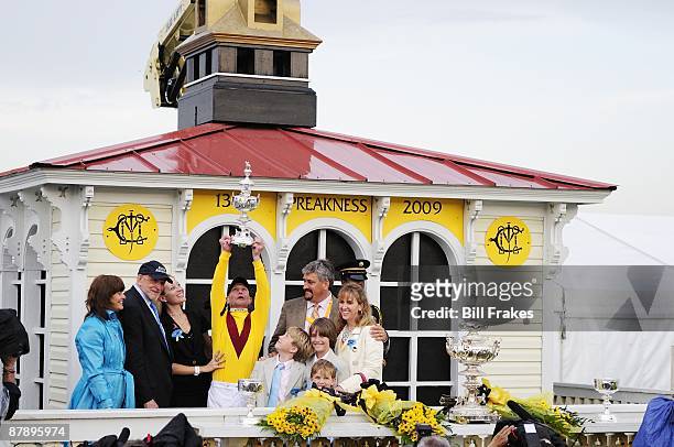 Preakness Stakes: Calvin Borel victorious with Woodlawn Vase replica trophy after winning race aboard Rachel Alexandra at Pimlico Race Course....