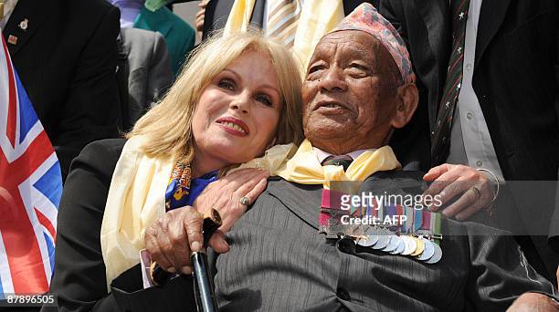 British actress and Gurkha campaigner Joanna Lumley celebrates with former Gurkha soldier Tul Bahadur Pun who saved her father's life, in central...