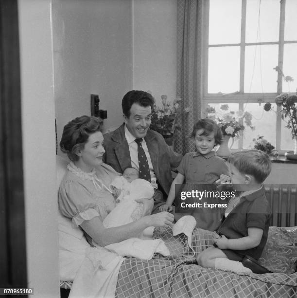 British actor and activist Brian Rix , and wife, actress Elspet Gray , introduce their newborn Jonathan to his siblings Louisa and Jamie, UK, 1960.