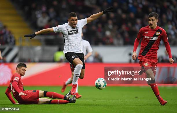 Simon Falette of Frankfurt is challenged by Lucas Alario of Leverkusen during the Bundesliga match between Eintracht Frankfurt and Bayer 04...