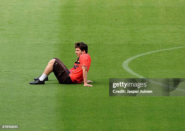Lionel Messi of Barcelona takes a break during a FC Barcelona training session held ahead of next week's UEFA Champions League Final at the Camp Nou...