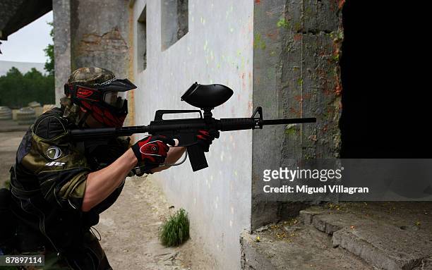 Man with spaintball marker simulates urban warfare at the Gotcha playground on May 21, 2009 in Vysocany, Czech Republic. The German government has...