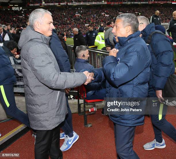 Manager Jose Mourinho of Manchester United greets Manager Chris Hughton of Brighton and Hove Albion ahead of the Premier League match between...