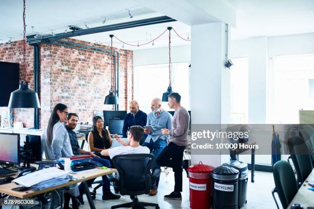 people working in modern office - group of mature men stock pictures, royalty-free photos & images